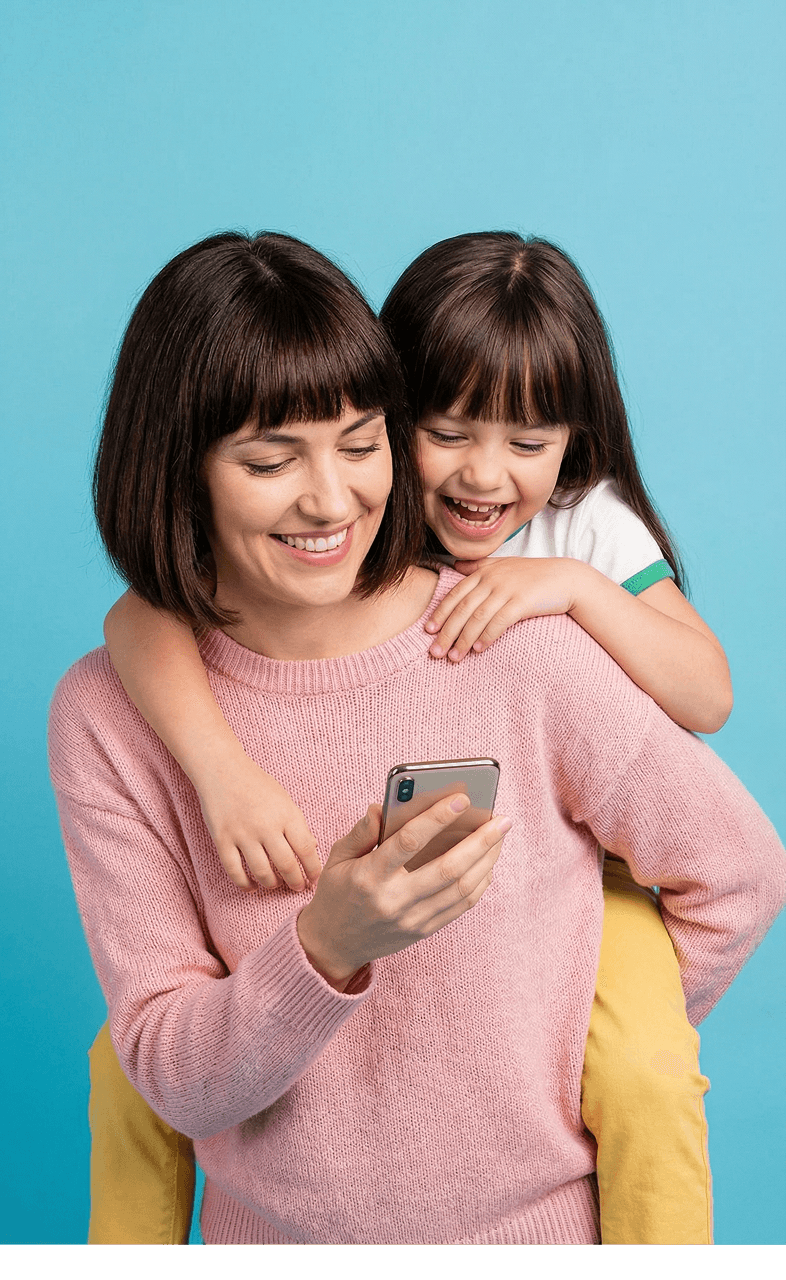 Mom and daughter smiling together